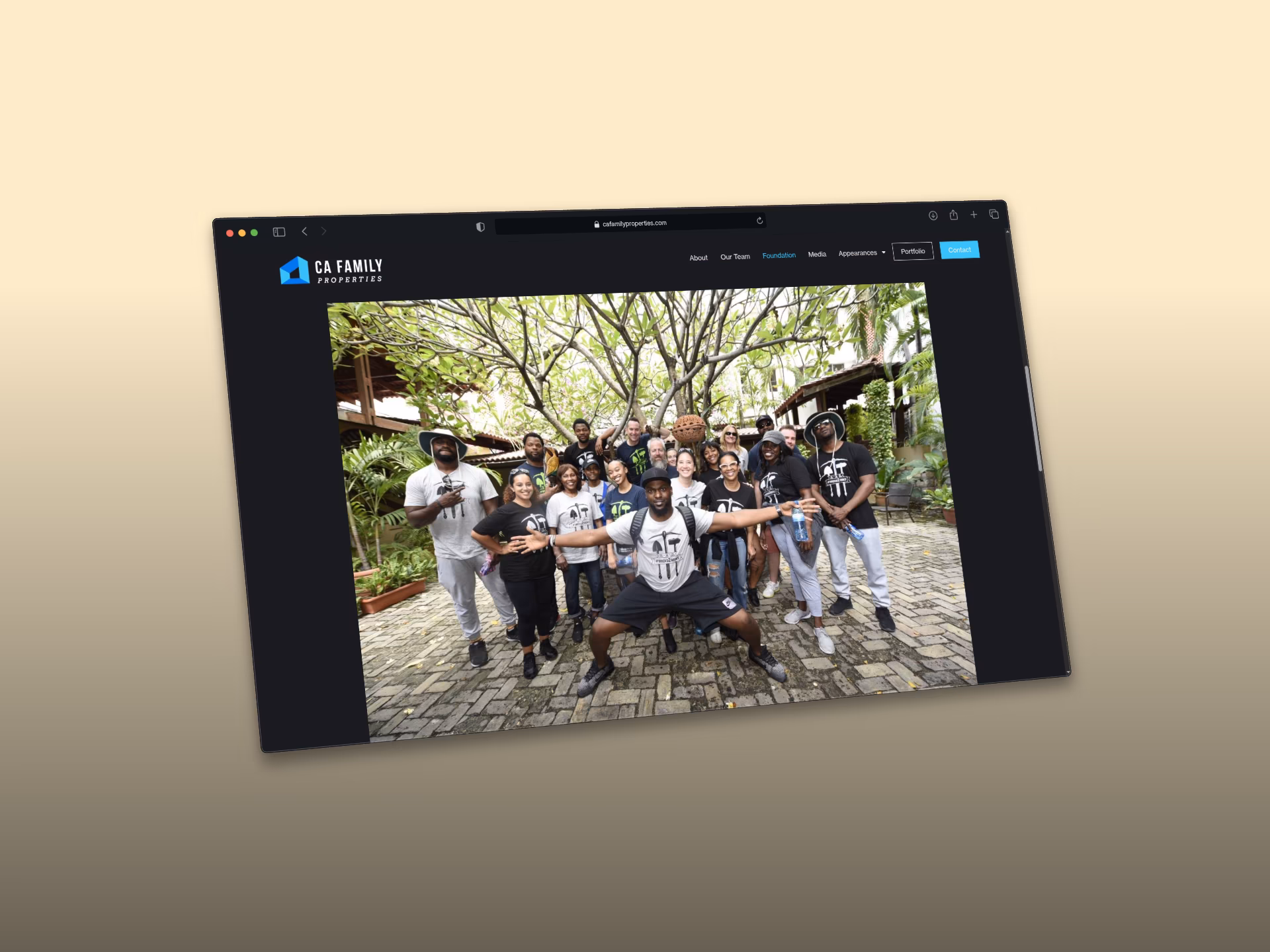 A Foundation page photo of Cliff with a large group from the community