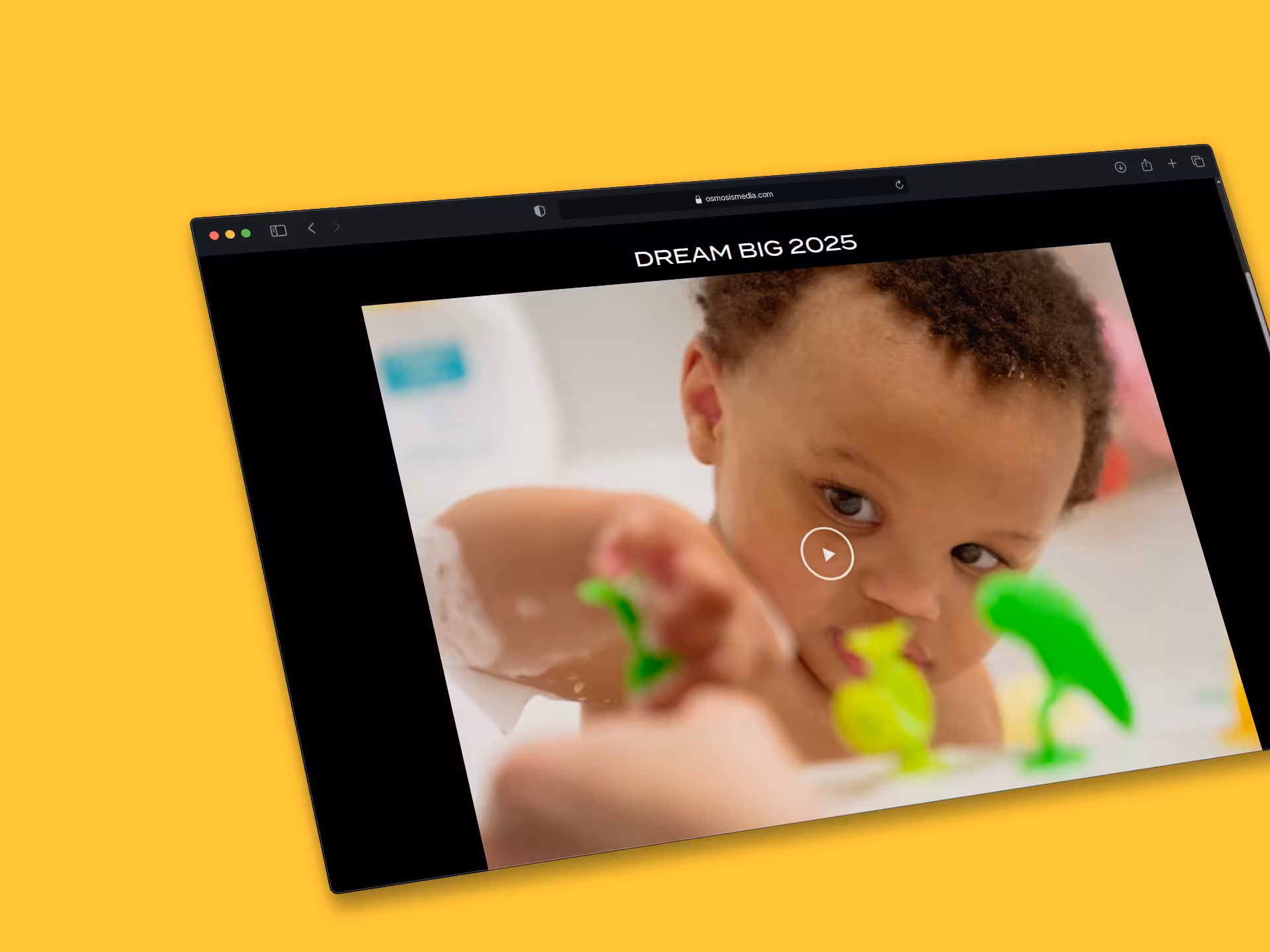 The Dream Big 2025 project on the site: a baby playing with toy dinosaurs